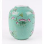 A Chinese famille rose vase, decorated flowers on a turquoise ground, 17cm high.