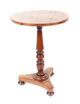 A 19th century figured mahogany occasional table, the baluster turned column on a triform