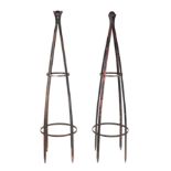 A pair of well weathered, heavy iron strap work garden obelisks, with ball finial, each approx 200cm
