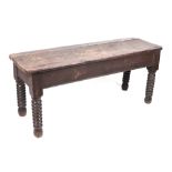 A 19th century oak hall bench, of peg construction, and having bobbin turned legs, 110cm wide.
