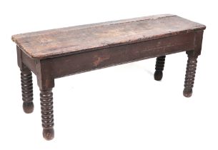 A 19th century oak hall bench, of peg construction, and having bobbin turned legs, 110cm wide.