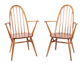 A pair of blonde Ercol Quaker Windsor chairs. Condition Report 1st chair- Splits on both arms