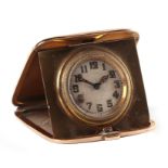 A 9ct gold cased travel clock, Birmingham 1923, 4.5cm wide, total weight 45.1g.