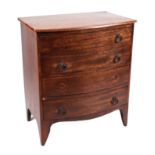 A 19th century mahogany bow fronted chest of small proportions, with four graduated long drawers,