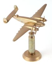 A trench art cast brass model of a Hudson aeroplane, mounted on a brass plinth, wingspan 25cm.