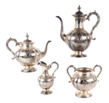 A Victorian silver four piece tea set, with elaborate engraved foliate decoration, Sheffield 1868/