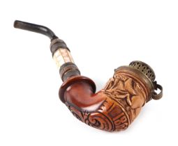 A German pipe, the bowl carved with a dog and dated 1862, having a mother of pearl shaft, 18cm