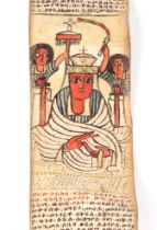 An antique Ethiopian Coptic manuscript pray scroll, in red and black script on sheep skin, written