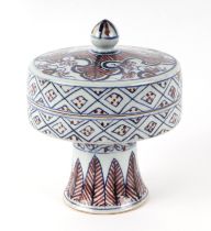 A Chinese blue, red and white pedestal bowl and cover, 14cm high.