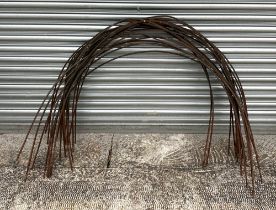 A large quantity of well weathered iron garden 'hoop' flower supports