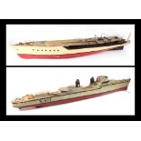 A scratch built model of a warship with painted wooden hull, approx 125cm long; together with