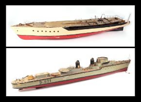 A scratch built model of a warship with painted wooden hull, approx 125cm long; together with
