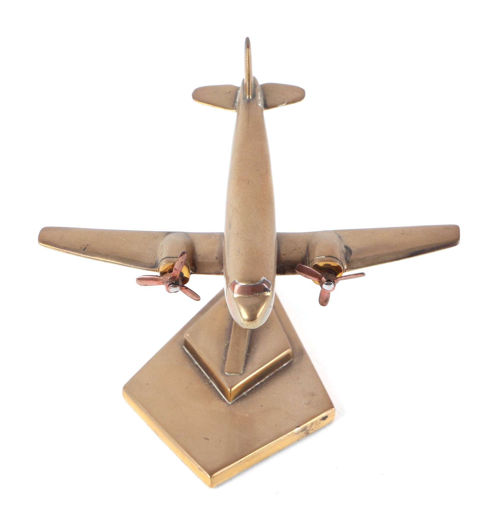 A trench art cast brass model of a DC3 Decoata aircraft, mounted on a brass plinth, wingspan 15cm. - Image 2 of 2