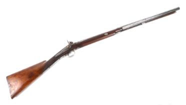 A Victorian black powered percussion capped sporting gun, with Damascus twist barrel, 119cm long.