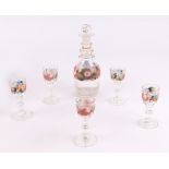 A 19th century Liqueur set, decanter and five glasses with hand painted flower decoration,