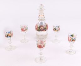 A 19th century Liqueur set, decanter and five glasses with hand painted flower decoration,