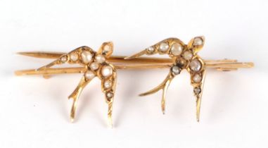 A late Victorian 9ct gold seed pearl set swallow bar cases,4cm wide, 2.4g. Condition Report Two