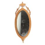 A gilt framed Adams style oval wall mirror, overall 79cm high.