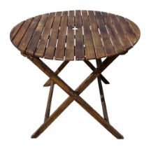 A folding circular wooden garden table 90cm diameter