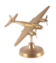 A trench art cast brass model of a Mosquito aeroplane, wingspan 22cm.