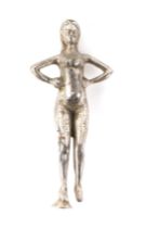 A plated car accessory mascot, in the form of a naked woman, 17cm high.