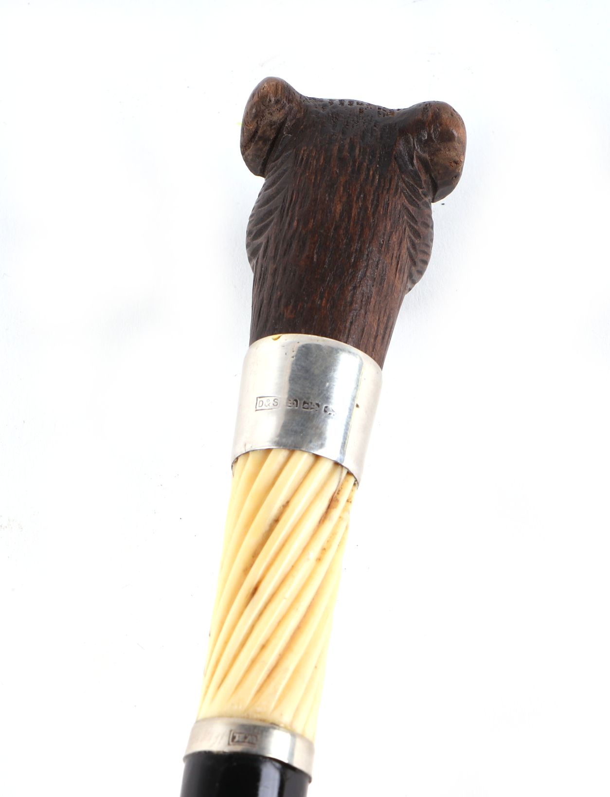 A Victorian ebonised walking cane, with silver collar and ivory section, having a carved soft wood - Image 5 of 5