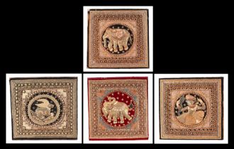 A group of four Indian needlework panels, depicting elephants and mythical creatures, each approx 39