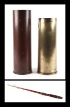 A WWI brass shell case, 32cm high, another similar, 37cm high, and White Bear spilt cane three piece