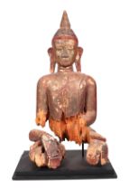 A large and impressive carved wooden Buddha with polychrome decoration, approx 105cm high, mounted