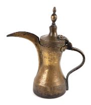 A large Turkish/Islamic brass Dalilah coffee pot, 36cm high together with two similar 24cms high and