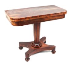 A Recency rosewood card table, having a rounded rectangular fold over top, on a tapering octagonal