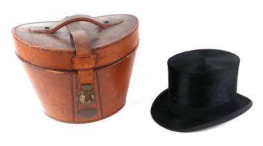A Tress & Co London silk top hat, 60cm circumference, together with a leather travelling case (2).