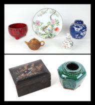 A Chinese blue and white prunus ginger jar, a set of stacking Chinese lacquer boxes, a Chinese tea