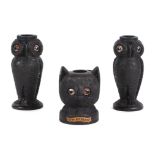 A pair of Irish carved bog oak needle / bobbin holders, in the form of owls, 8cm high, and another