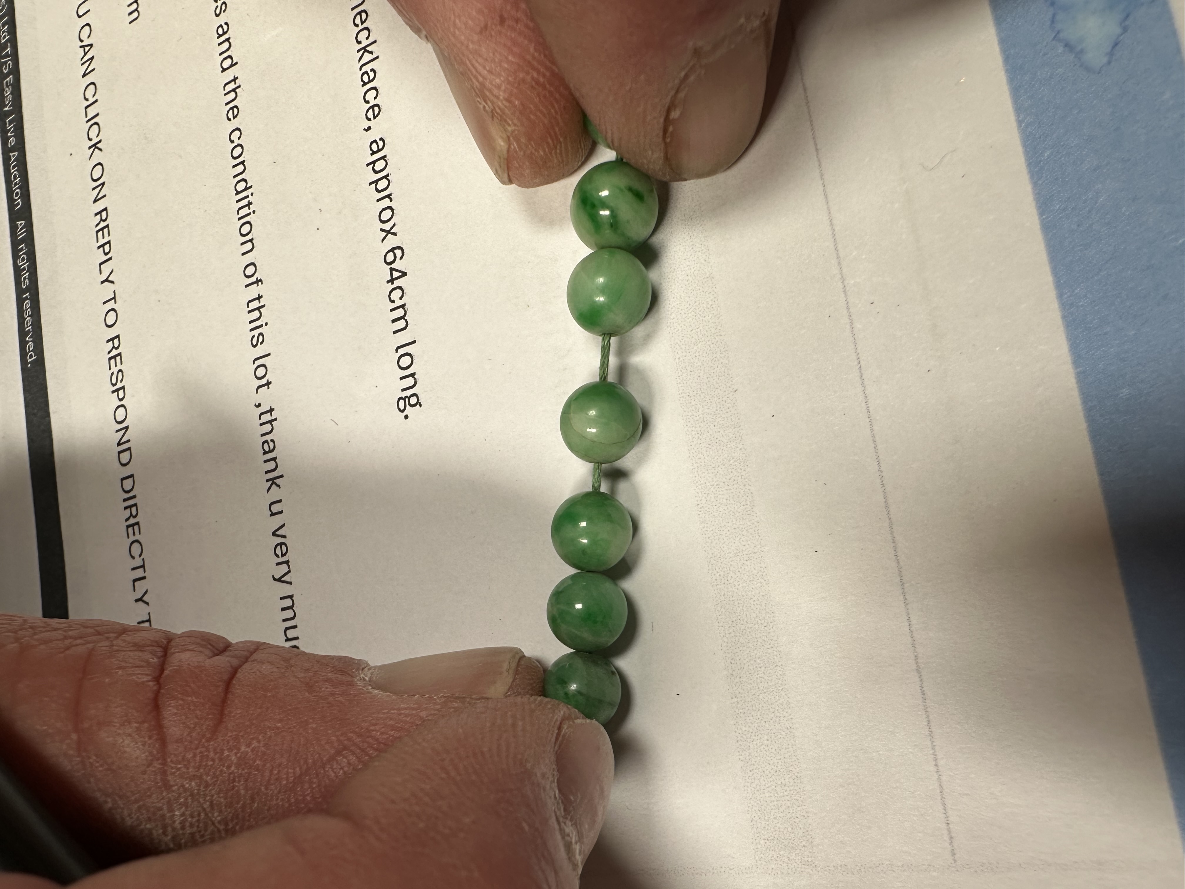 A Chinese graduated apple jade bead necklace, approx 64cm long. Condition Report A crack to one - Image 7 of 7
