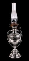 A Victorian twin handle silver plated oil lamp, with engraved decoration, 39cm high without
