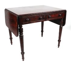 A 19th century mahogany drop flap sofa table, cross banded, having two real and two faux frieze