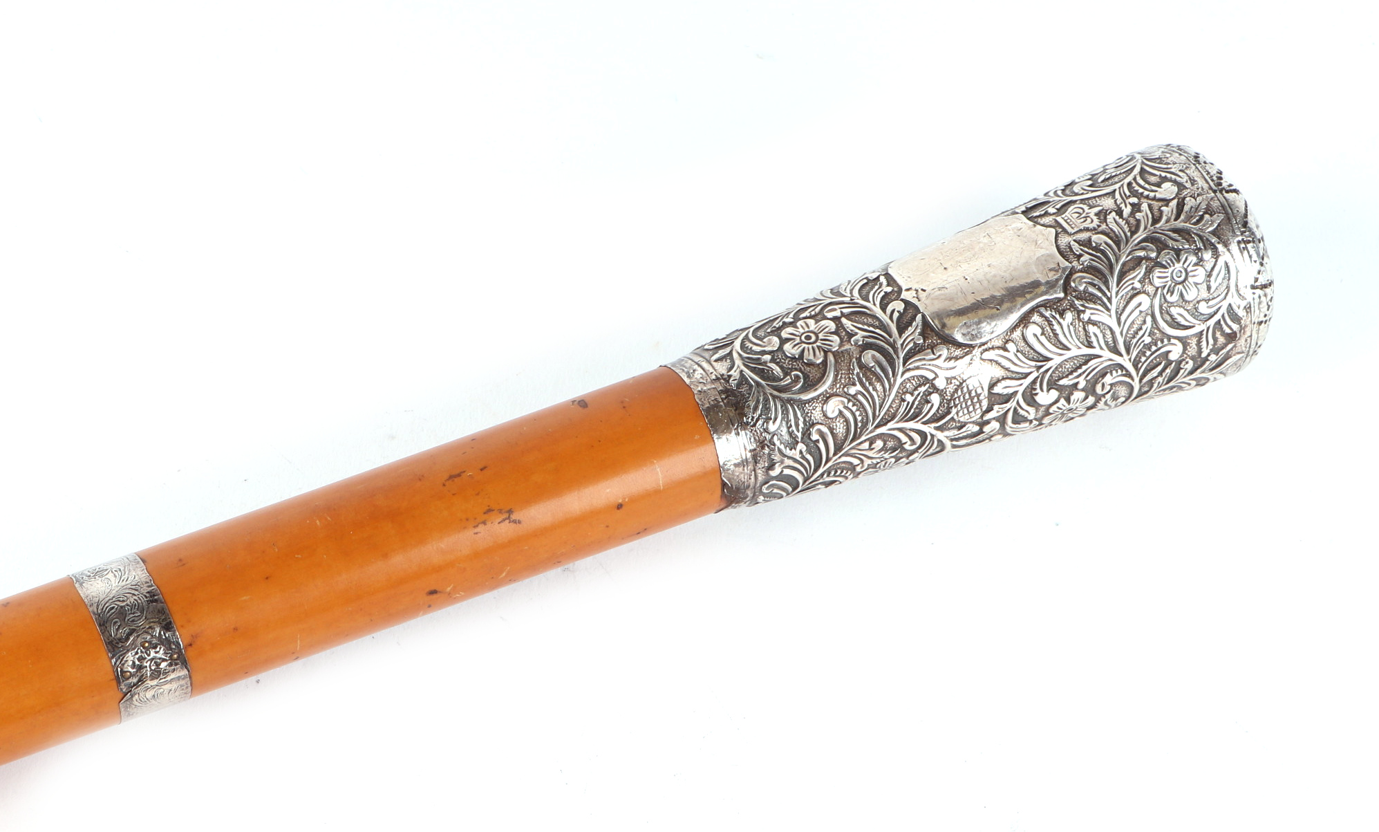 A late 19th century Malacca walking stick, with white metal band, ornate white mental handle, 91.5cm - Image 2 of 3