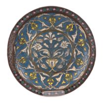 A Syrian enamelled charger, decorated stylised flowers, 42cm diameter.