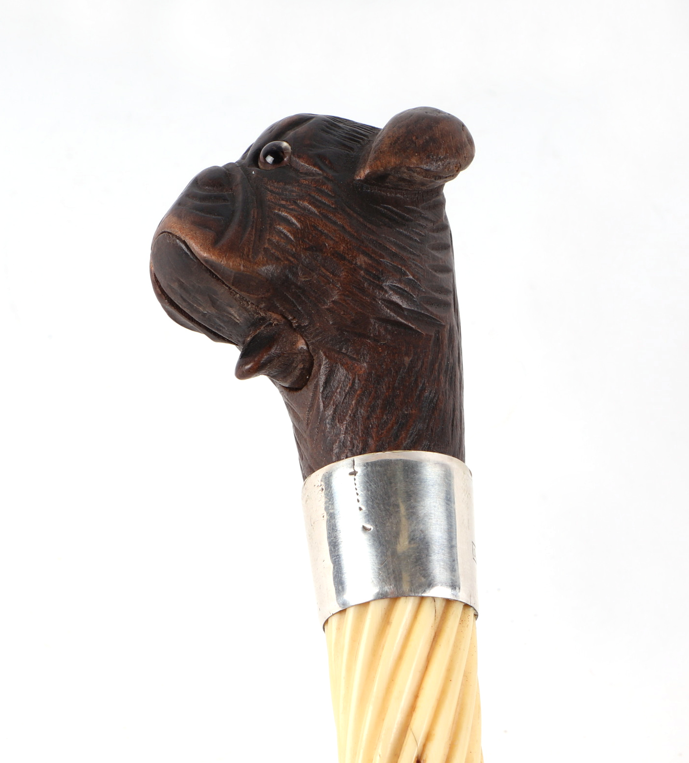 A Victorian ebonised walking cane, with silver collar and ivory section, having a carved soft wood - Image 2 of 5