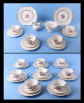 An early 19th century 40 piece porcelain tea set, with hand painted floral decoration, possibly