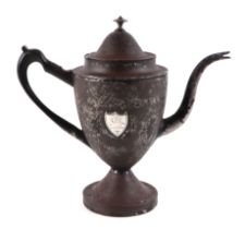 A Georgian toleware coffee pot, with applied shield shaped silver plaque, 25cm high.