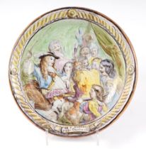 A French pottery charger, decorated a tavern scene, with motto Par St George Je Te Fais Cherlaies,