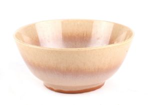 A Clarice Cliff art pottery footed bowl, with high fired mottled brown glaze, 20cm diameter.