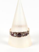 A 9ct gold garnet and pearl ring, approx UK size Q, 1.6g.