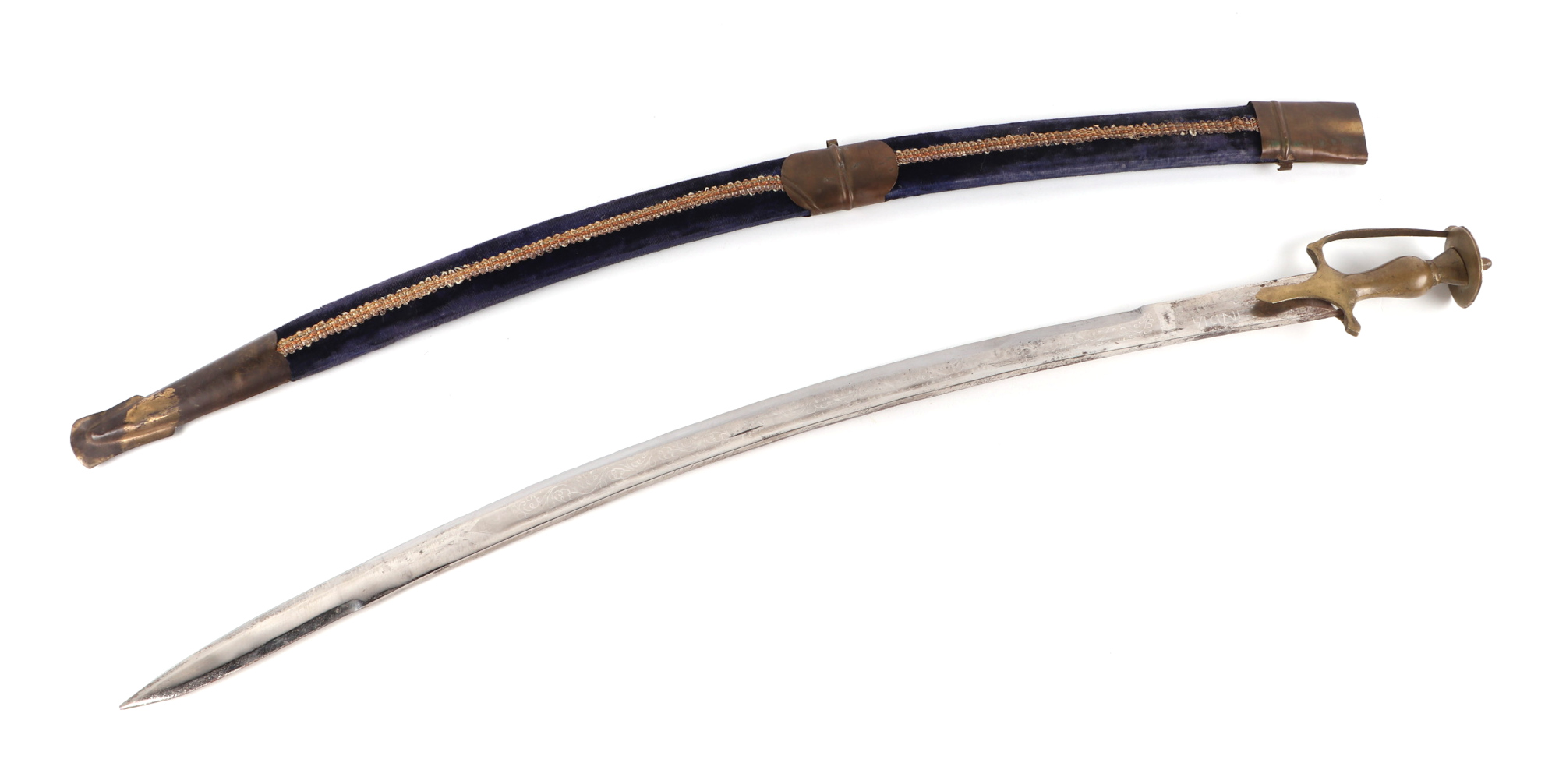 An Indian shamshir type modern sword, with engraved steel blade, brass hilt and velvet covered