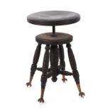 A late 19th century painted wooden stool, with rise and fall adjustable seat, on turned legs with