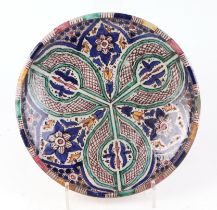 An Islamic/North African pottery bowl, having traditional glazed decoration, 28cm diameter.