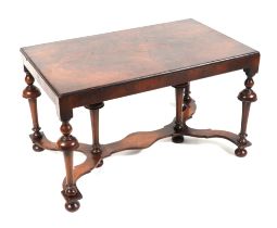A William and Mary style walnut low side table on turned legs, joined by a shaped stretcher, 76cm