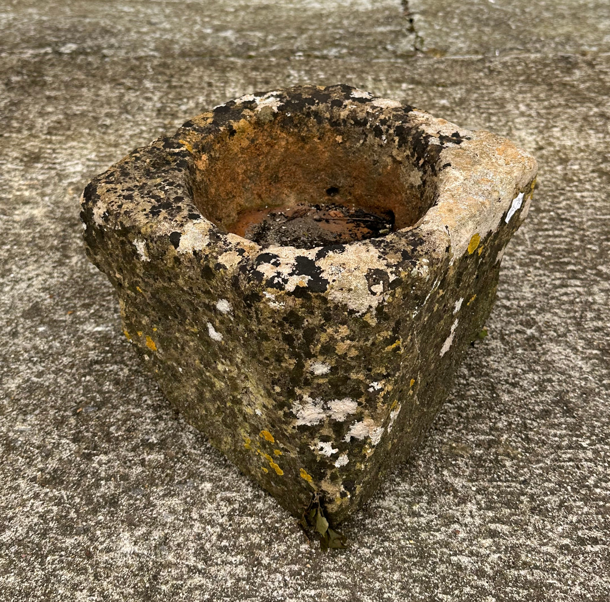 An early well weathered carved stone font, removed from a Bath Rectory, 32cm diameter.